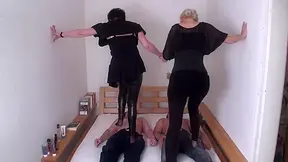Brunette and blonde are trampling on their slaves by Femdom Austria