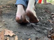 Mud barefoot in jeans