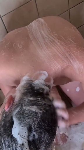 Pissing on a girls face and hair to rinse her off in the shower   Clip 1