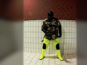 Pawing off in camo painter's overall and hi-viz waders
