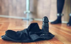 A Woman Wearing Dildo Pants and Masturbating While Restrained