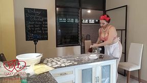 Nudist housekeeper Regina Noir cooking at the kitchen. Naked maid makes dumplings. Naked cooks. Bra