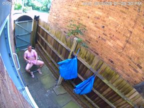 Caught on my neighbours camera in my pink bikini, caged clit and butt plug in.