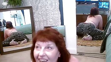 Red haired granny, Stevens is displaying her big ass in front of the web camera