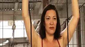 Mature brunette mom bound and plastic wrapped in BDSM scene