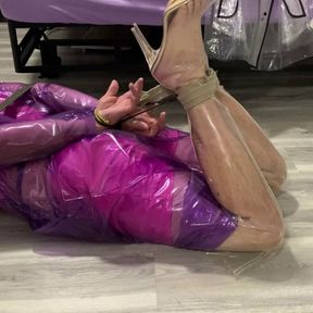 Hogtied in purple plastic raincoat