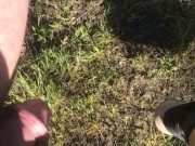 Peeing off tailgate outdoors