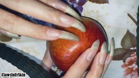 Clawing poor apple with nails