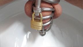 Old Clip from 2017: Pissing through the Plug of Chastity Cage