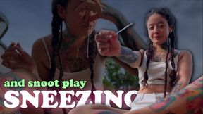 Naughty girl outside sneezes and plays with snot