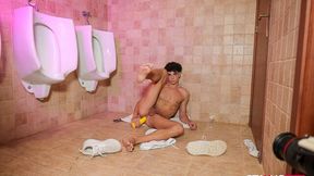 Naked twink Jimeno jerks off in the public restroom