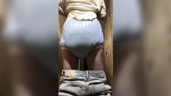 Young twink shows off his diaper in close-up fetish play