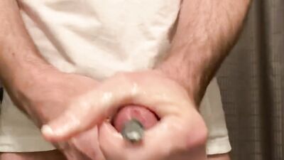 Close up of sounding a rubber bolt all the way down my big cock for the first time