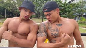 ”Two sexy latino guys show their muscles”