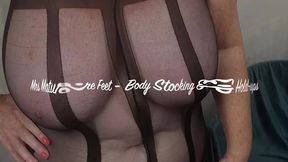 Mrs Mature Feet wearing a very sexy bodystocking and hold ups