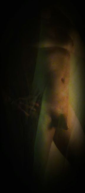 A handsome man alone at home naked caresses himself.