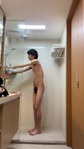 Asian skinny boy debugging water heater in Hong Kong hotel