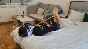 A girl wearing a mask with her mouth tightly sealed and bound (Chinese Model)