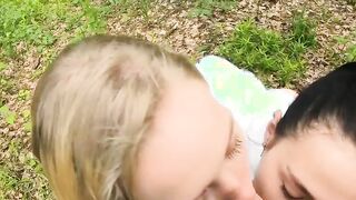 Two Girlfriends Suck Cock in the Wood