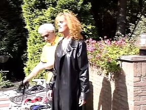 Leather woman gets dominated outdoor