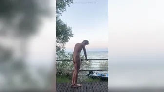 Muscular young nudist jerks off in a quiet public spot