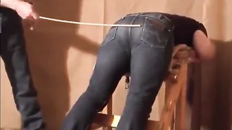 Asian twink caned over tight jeans by older daddy