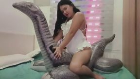 Freya riding inflatable dino