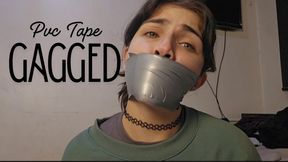 Gagged with pvc tape and moaning