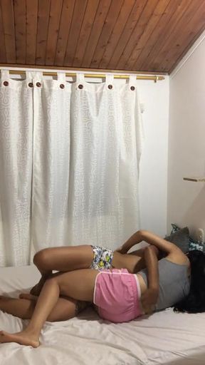 Two hot girls fuck each other by scissoring