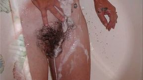 Naughty wife of mine loves flashing her impressive bush while taking shower