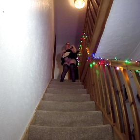 Maid cleaning the stairs in stockings