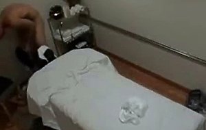 A chinese massage attendant giving a handjob