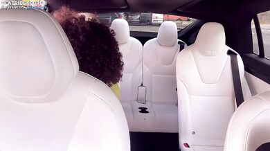 His girlfriend squeezes my cock while his wife sucks him in the backseat of a Tesla