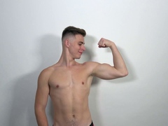 Muscle boy Jonathan Hicks shows his abs