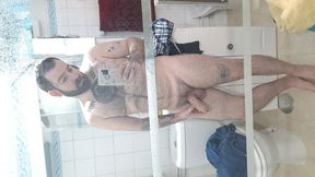 Bear before shower<br />
Bear shows off his big cock before taking a shower