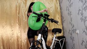 Biker girl inflates an inflatable ring