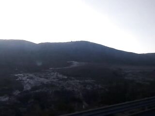 Tour, cemetery and mountains