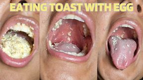 Eating toast with scrambled eggs