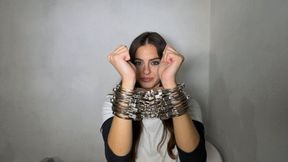 Gaia opens eight pair of handcuffs on her wrists