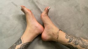 feet dirty with mud from the camp