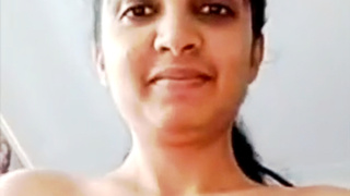 Handsome indian chick unwrapping naked on cam finger-banging vulva