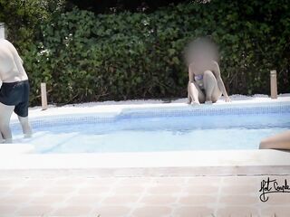 Having enjoyment in a pool of a swinger club!!