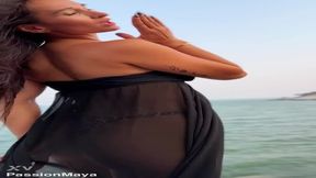 Hot brunette stuns in black long dress at public art display