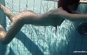 Mia babe swimming naked in the pool