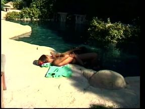 Ebony best friends licking each other's clit in the pool