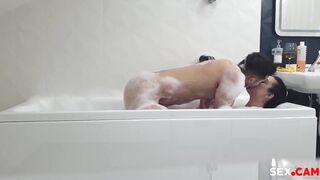 couple fucking in a bathtub