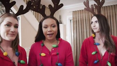 Three horny young babes in costumes share a big Santa dick