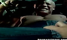 Jock bound with fat rope in outdoor BDSM scene