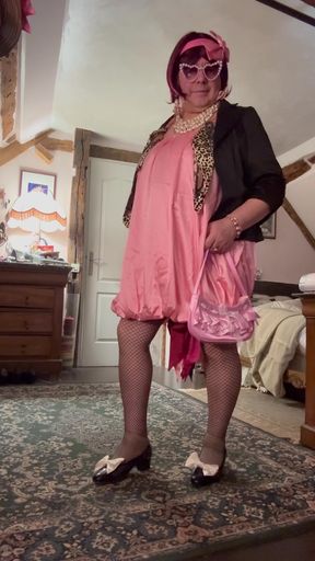 Dressed in a pink ball dress for an evening