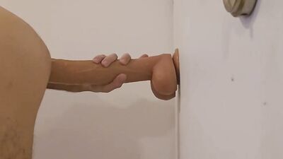 A bisexual man rides a huge dildo. in sexy clothes